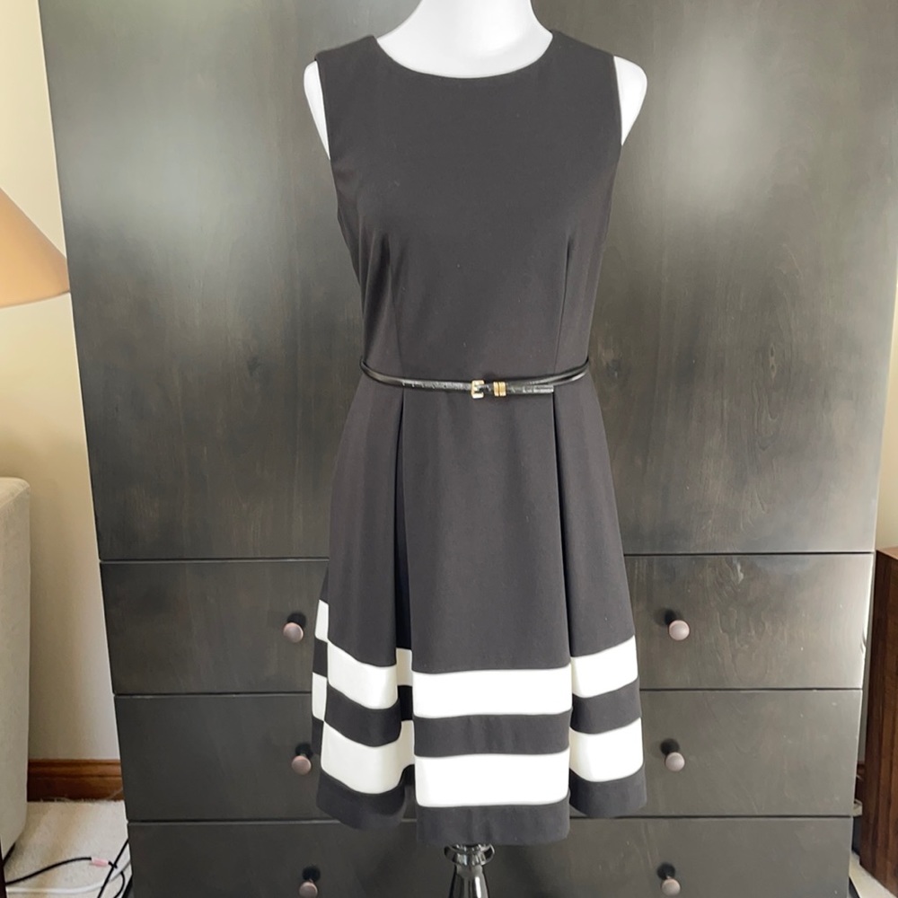 Calvin Klein black sleeveless, belted dress.